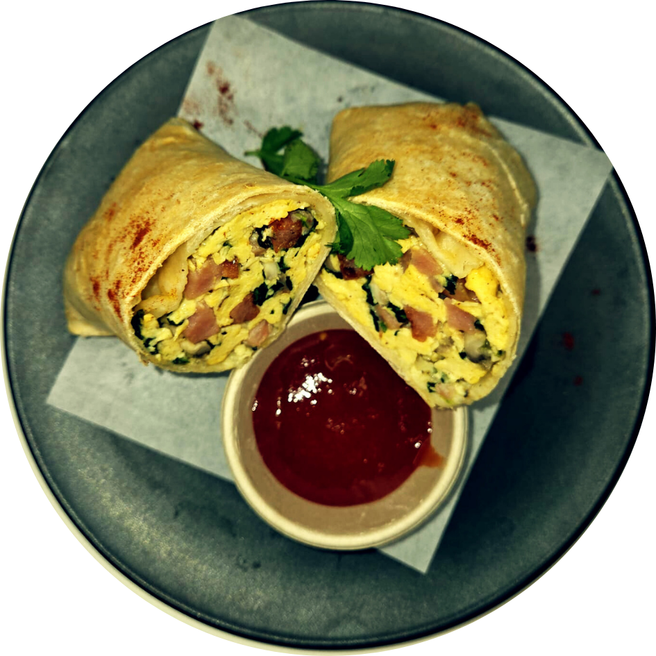 Eggs Benedict breakfast wrap with eggs, bacon, cheese, capsicum and spinach